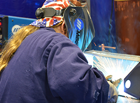 Brett (15 yrs) welding her toolbox