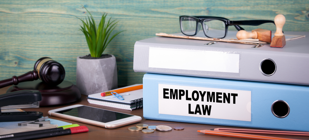 Employment law binder on desk