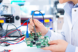 Engineers working with circuits
