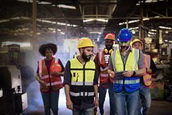 group of manufacturing workers on a safety gemba walk