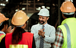 Project manager meeting with workers