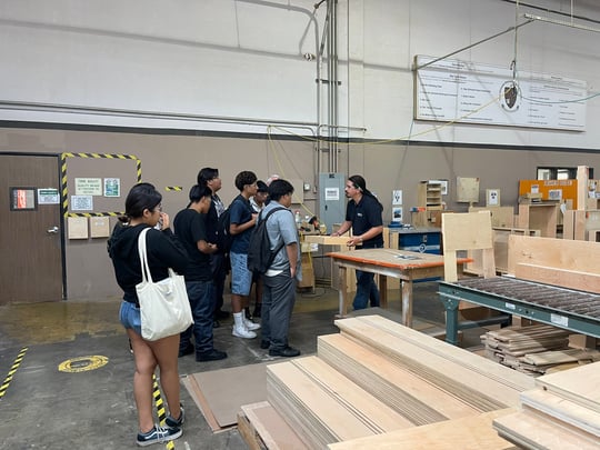 Students touring Reborn Cabinets facility