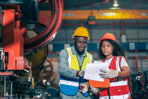 Two engineers in manufacturing facility